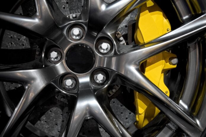 black rim yellow brake pad