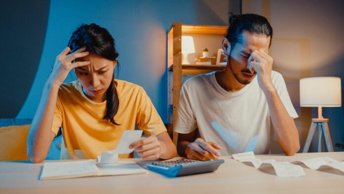 Stressed couple looking at finances