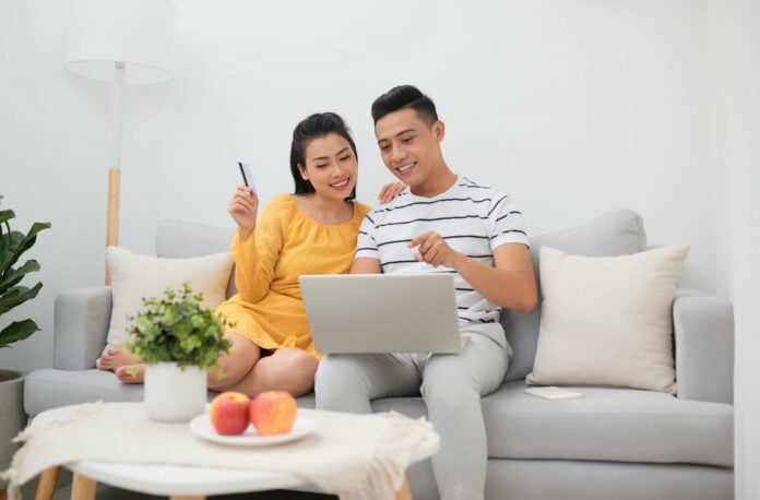 Happy couple buying things online