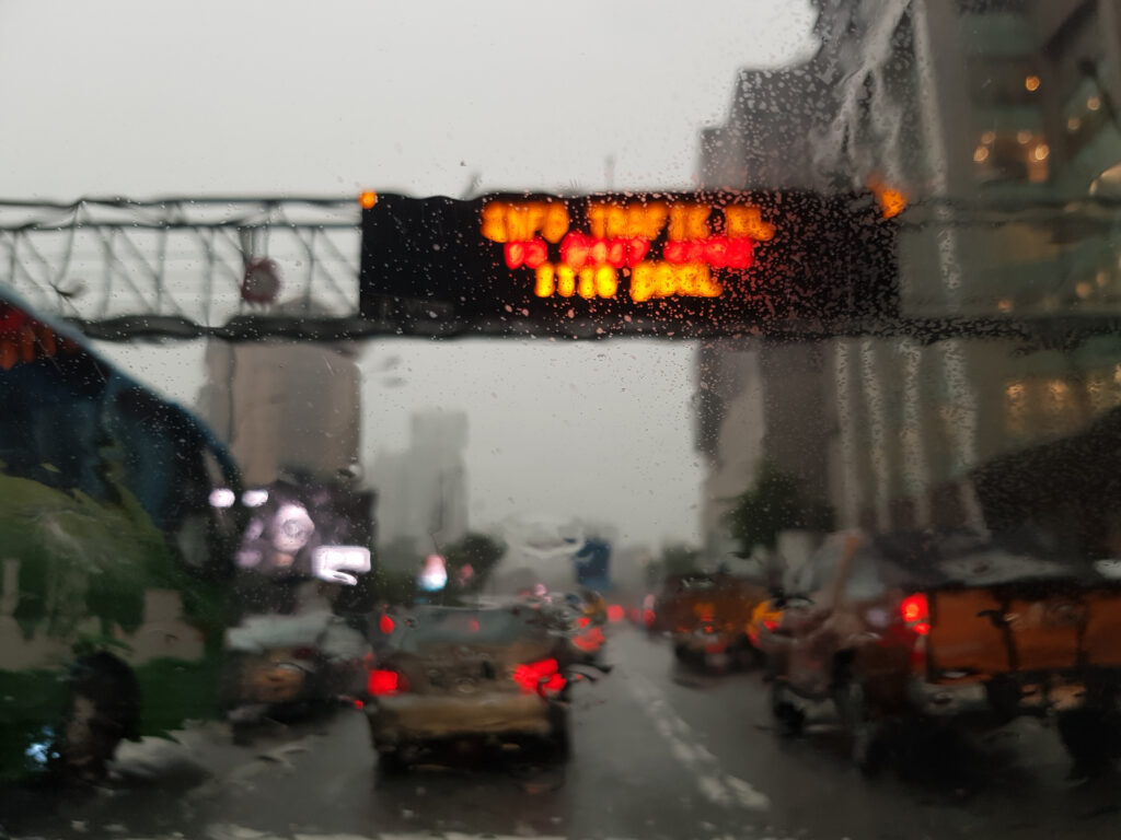 Traffic condition during raining season in Kuala Lumpur viewed from car